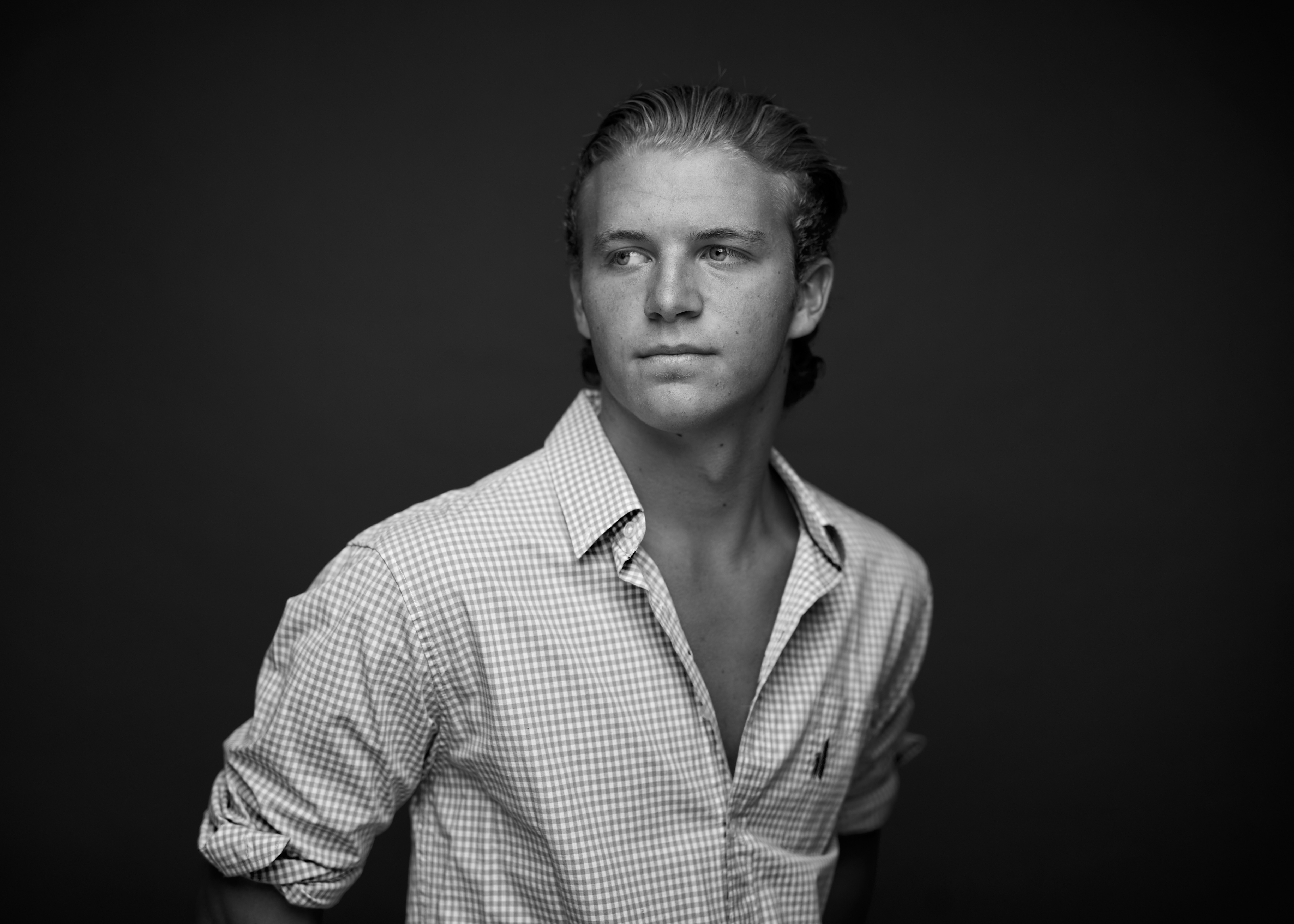 August Miller headshot, black and white